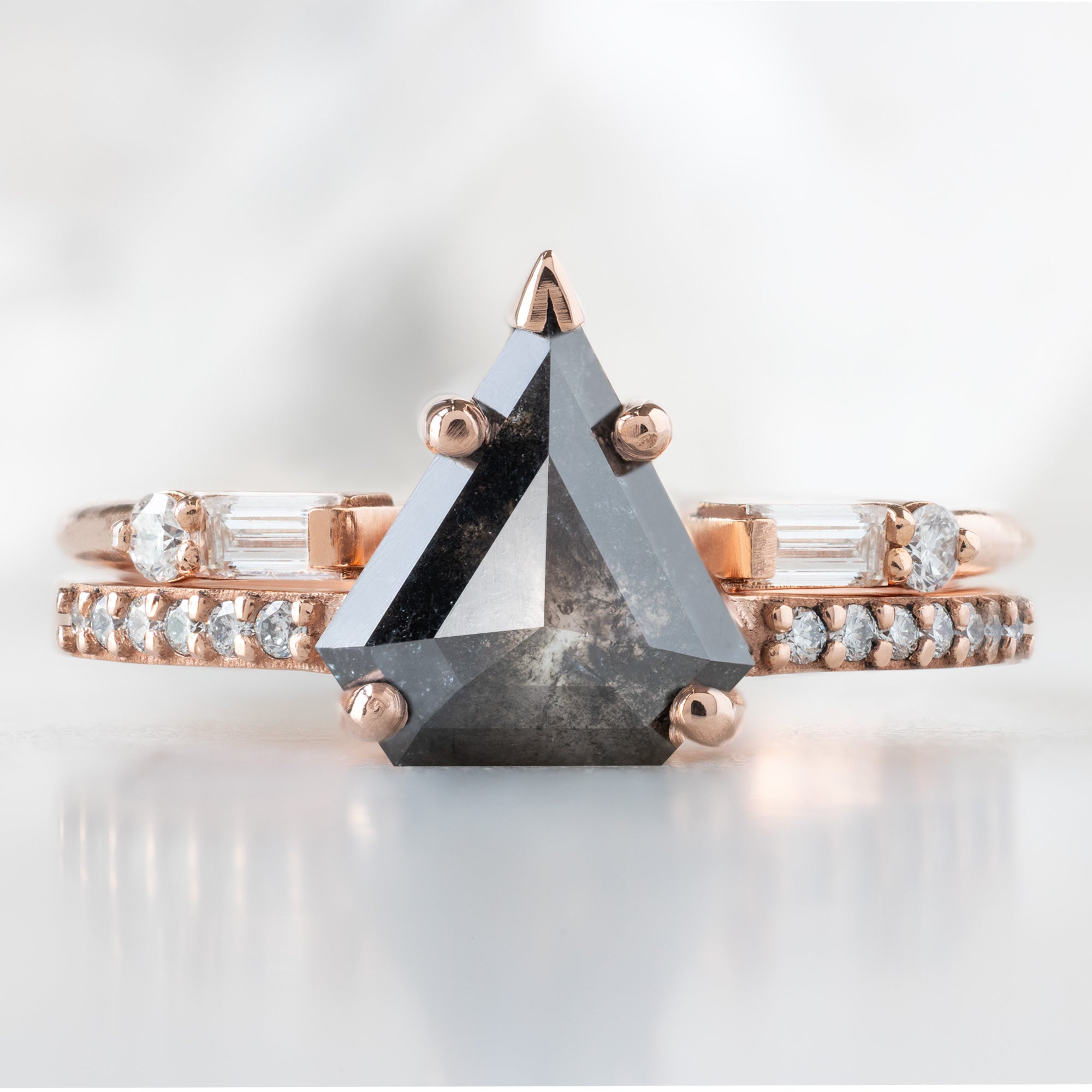 The Willow Ring with a 1.19ct Shield Black Diamond in 14K Rose Gold Stacked with the Luxe Open Cuff Baguette Diamond Stacking Band on White Background