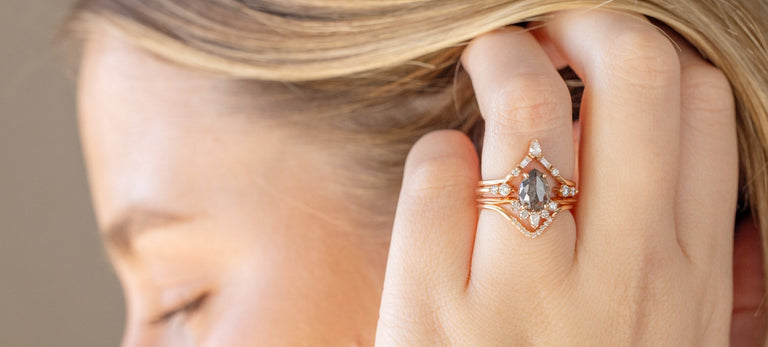 model wearing rose gold salt and pepper diamond engagement ring
