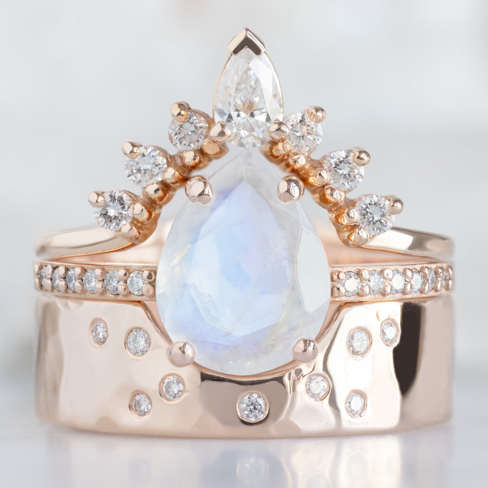 buy:white-pear-diamond-sunburst-stacking-band-14k-gold,the-willow-ring-1-38ct-pear-moonstone-in-14k-rose-gold-2,constellation-cut-out-stacking-band-arc-cut-out-in-14k-yellow-gold
