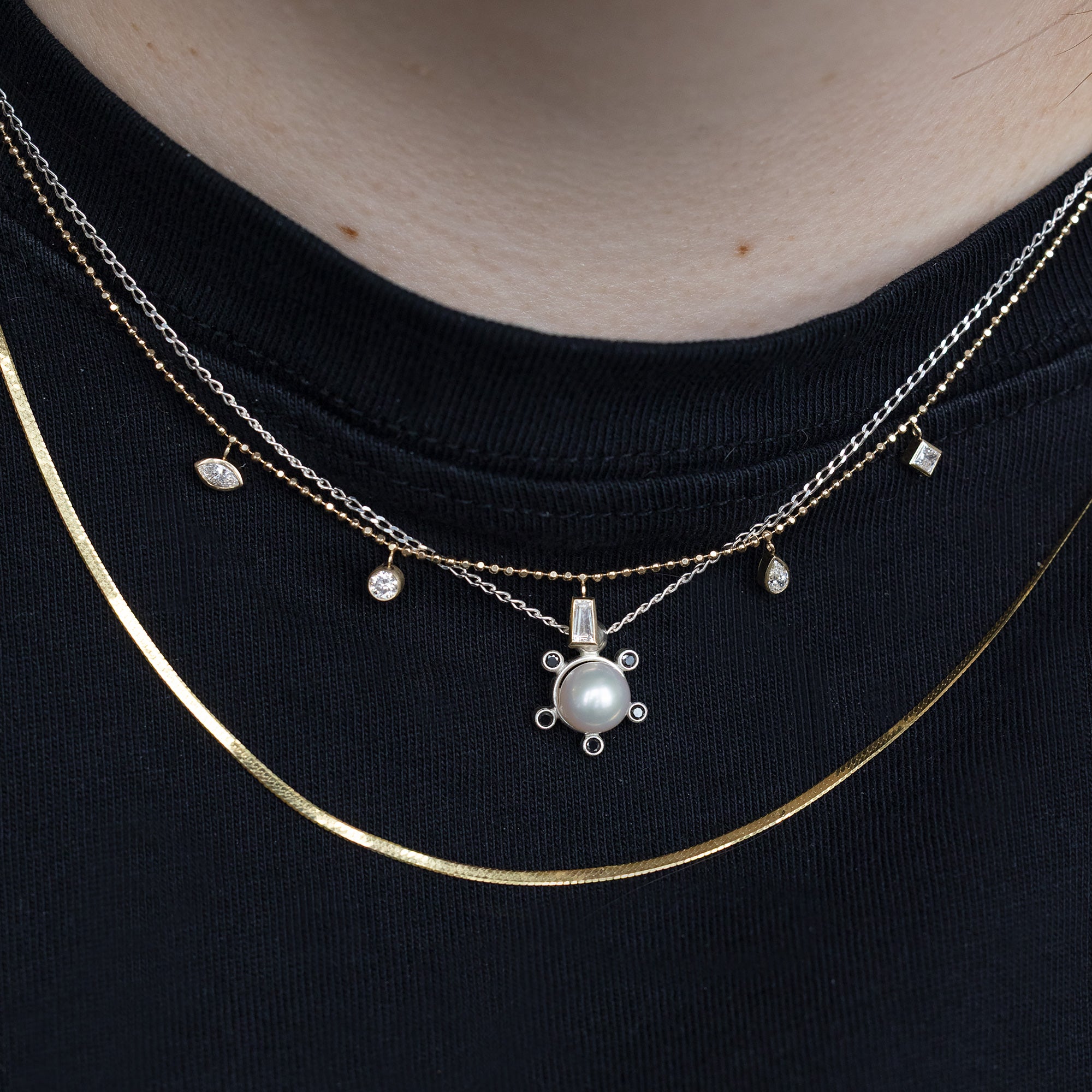 buy:pearl-compass-necklace-sterling-silver,diamond-pennant-necklace-10k-yellow-gold,the-herringbone-chain-necklace-14k-yellow-gold
